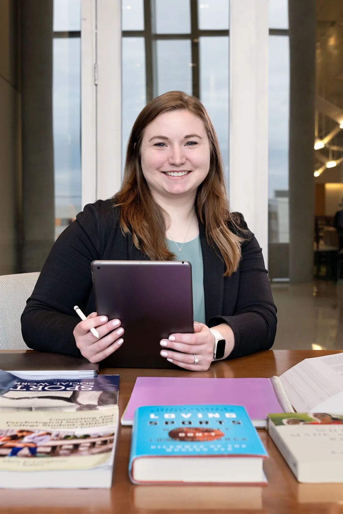 Person posing with book.