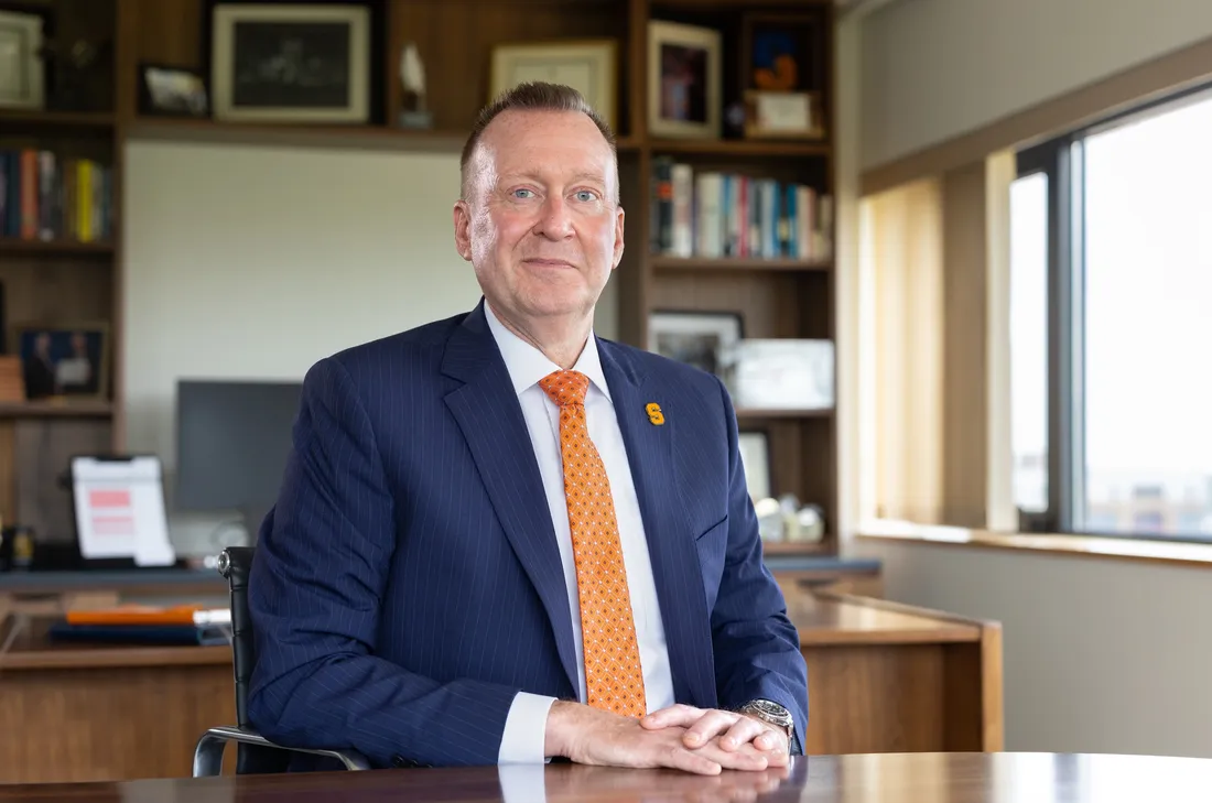 Chancellor Mike Haynie sitting in his office and smiling.