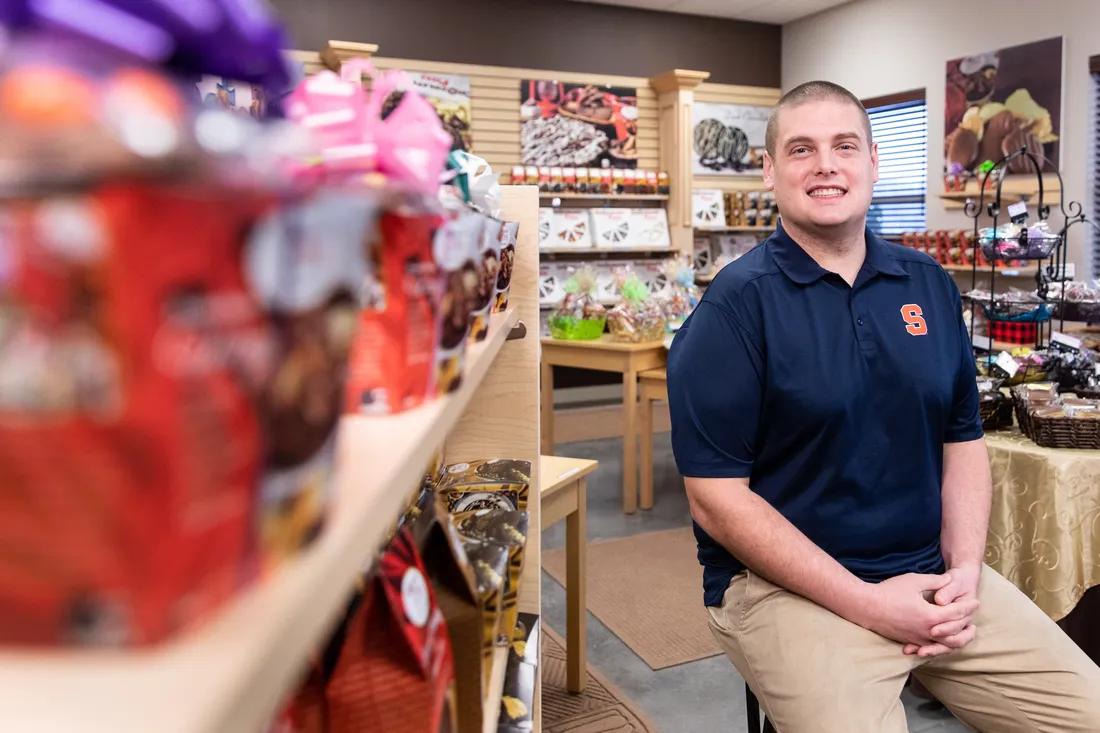 Ryan Novak sitting inside of business.