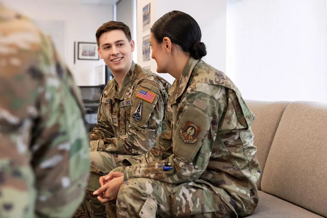 Benjamin Johnson talking with fellow ROTC student.