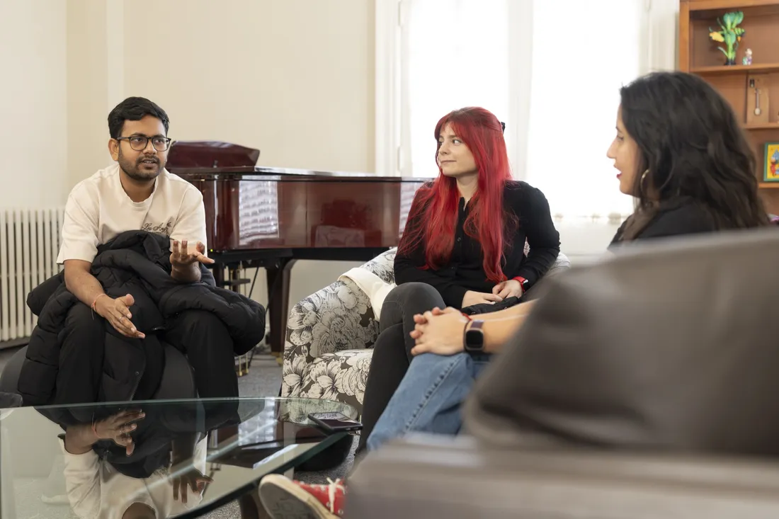 International students sitting together and conversing.