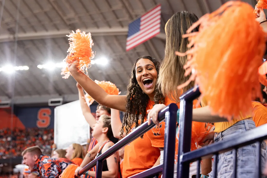 Students cheering in the crowd.