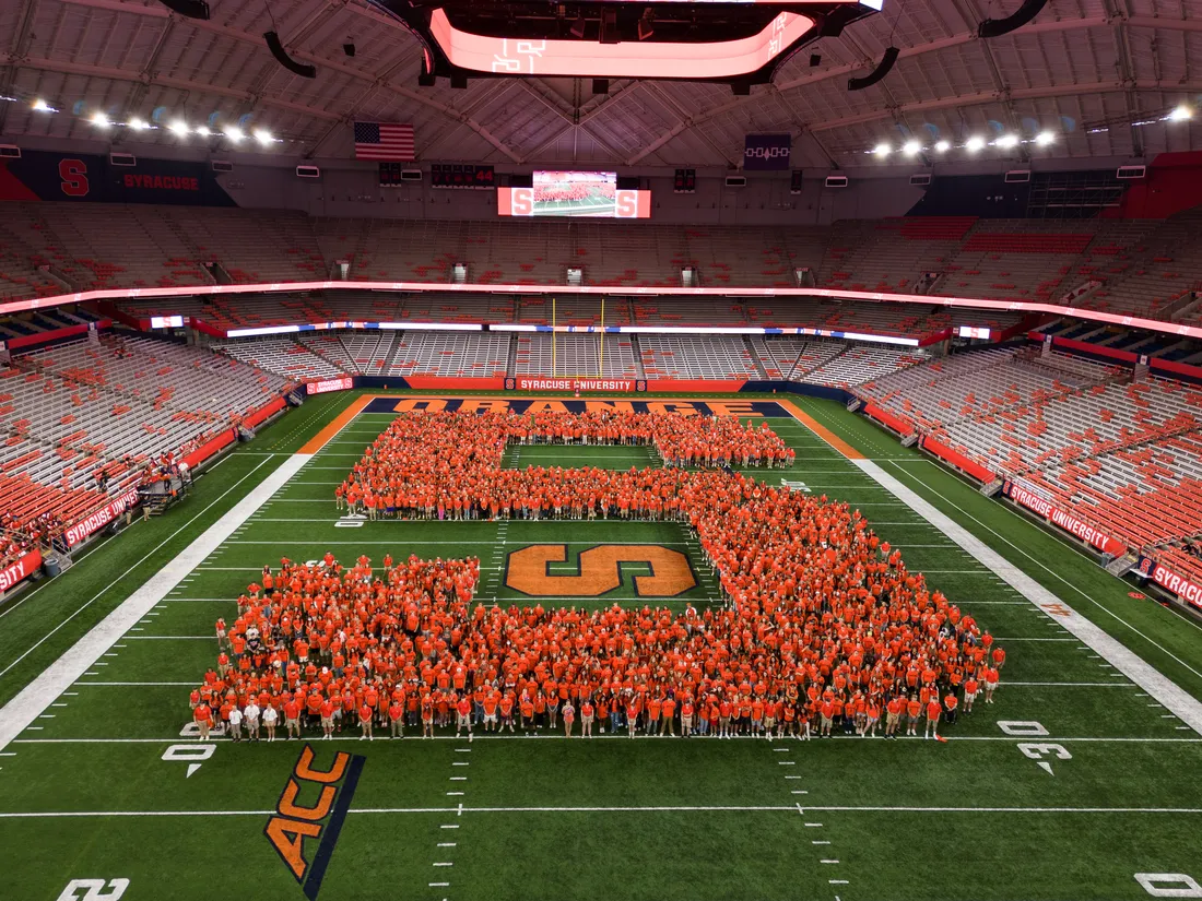 Students forming the block s at the JMA Dome.