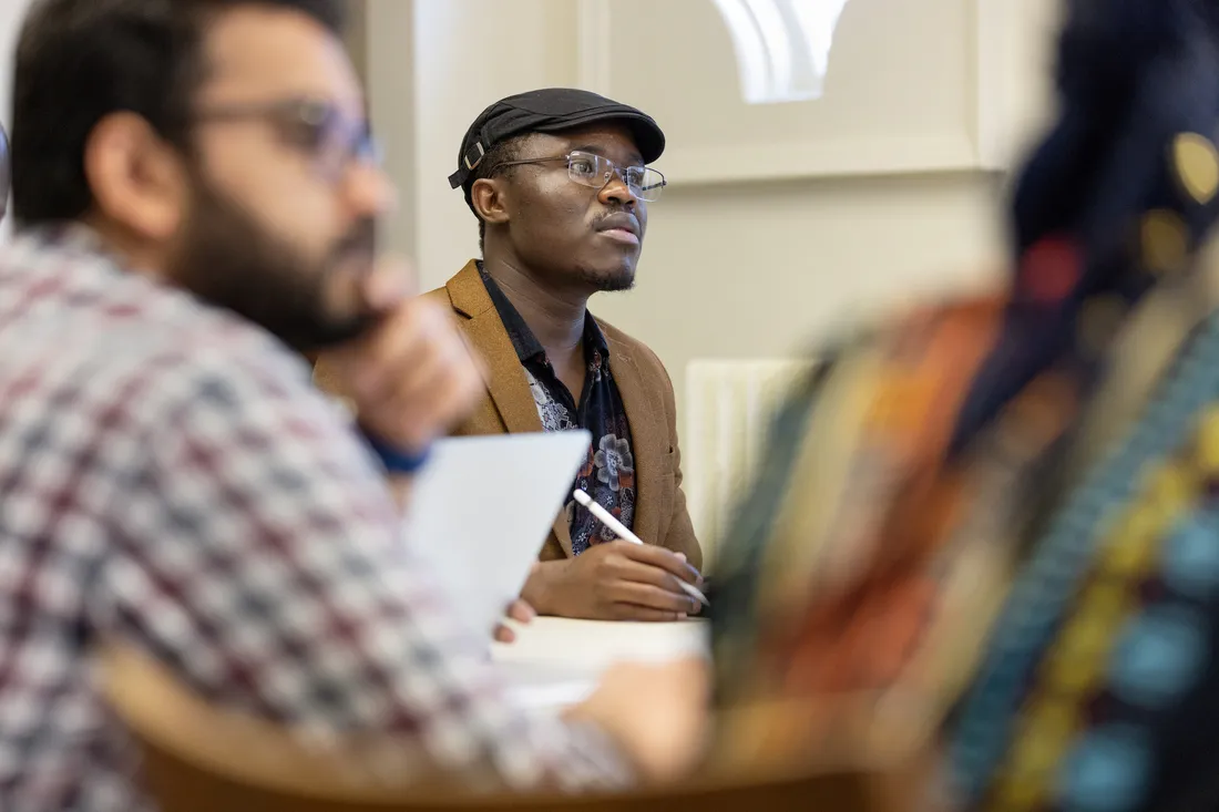 Students in a classroom listening to lecture.