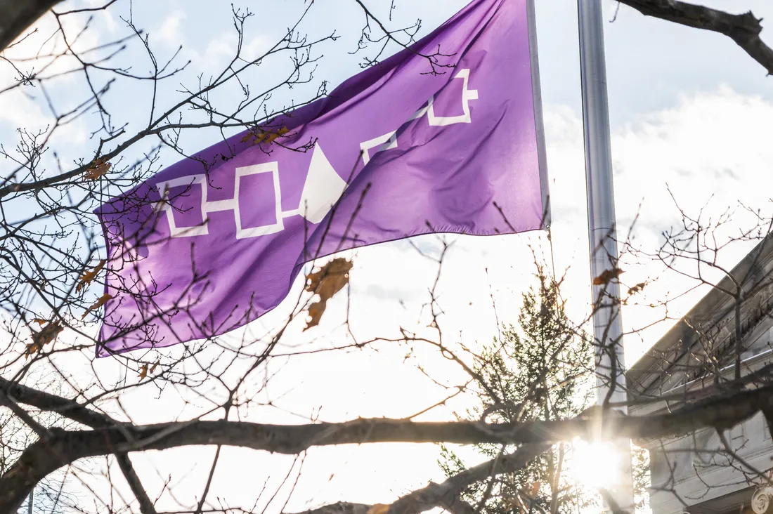 Haudenosaunee flag waves in the sun.