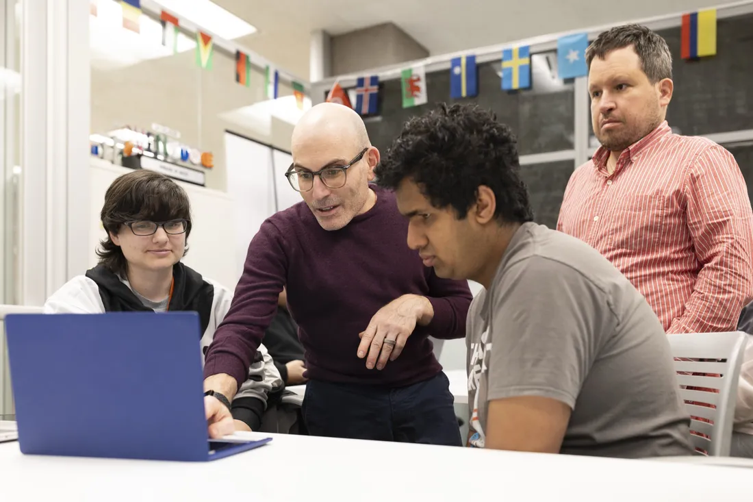 Group of students working with Professor Alan Foley on a project for the Intelligence++ program.