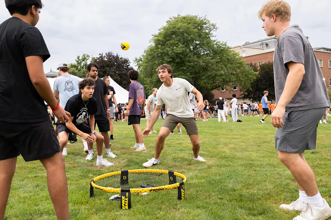 People playing a game on the lawn.