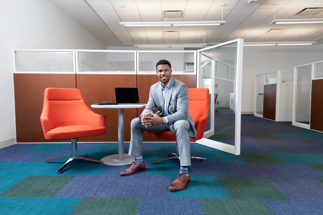 Business student sitting and smiling.