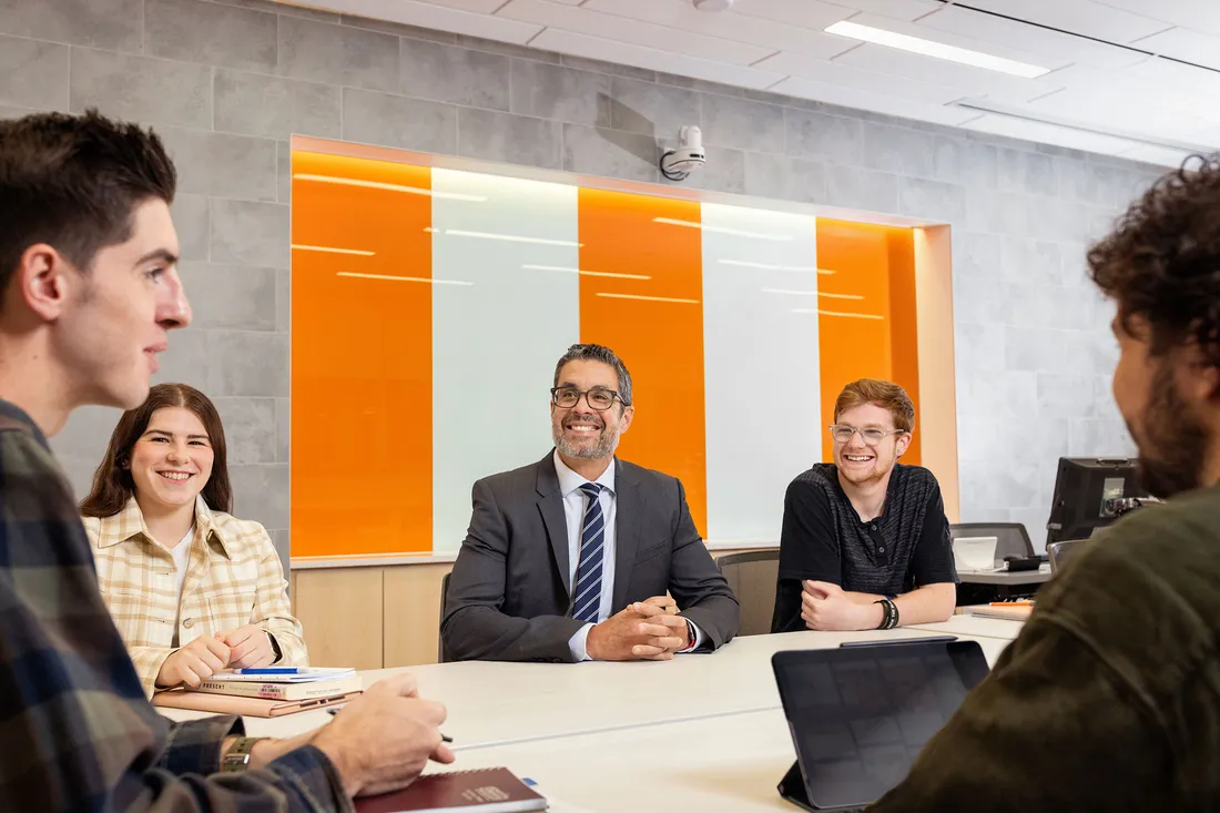 Group of people sitting at a table talking