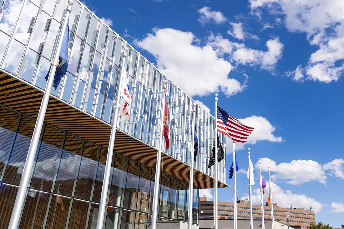 Flags waving outside the National Veterans Resource Center.