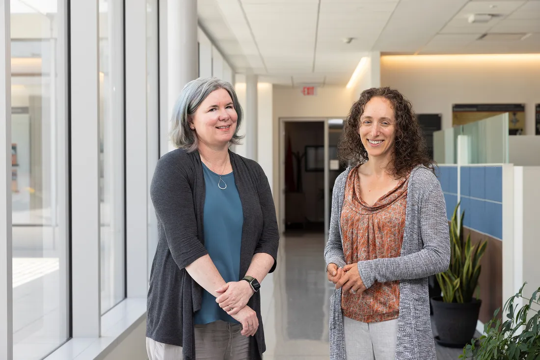 Deirdre Joyce and Bonnie Chapman Beers ’03 standing together, smiling.