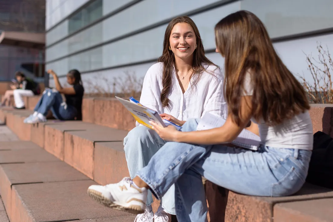 Olivia Pess talking with a friend outside Whitman.