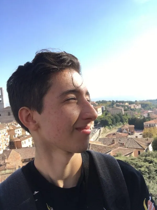 Eliot Raynes portrait with Italian landscape in background