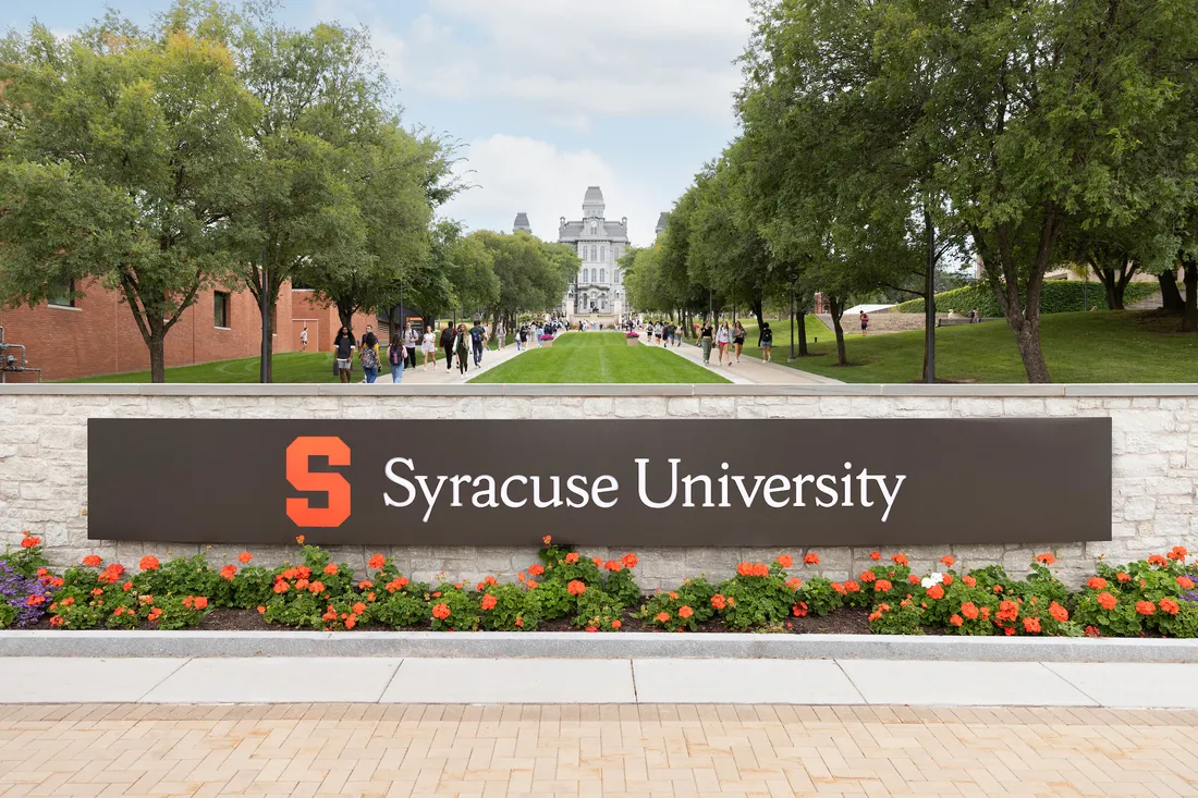 Syracuse University campus sign in front of the Hall of Languages.