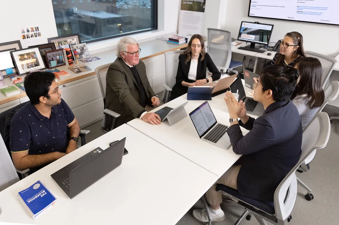 A group of students and Professor Brian Gerling meet in the Innovation Law Center.