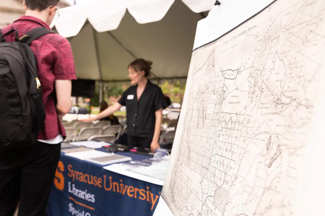 Indigenous land map on display at a booth.