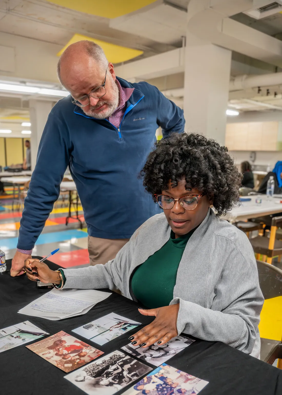 People looking at photos.