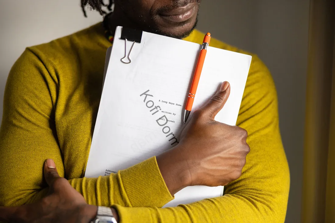 Person holding a script.