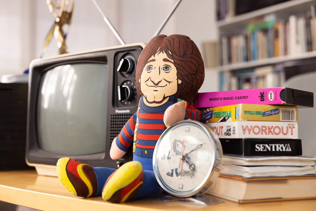 Doll of Robin Williams on a desk