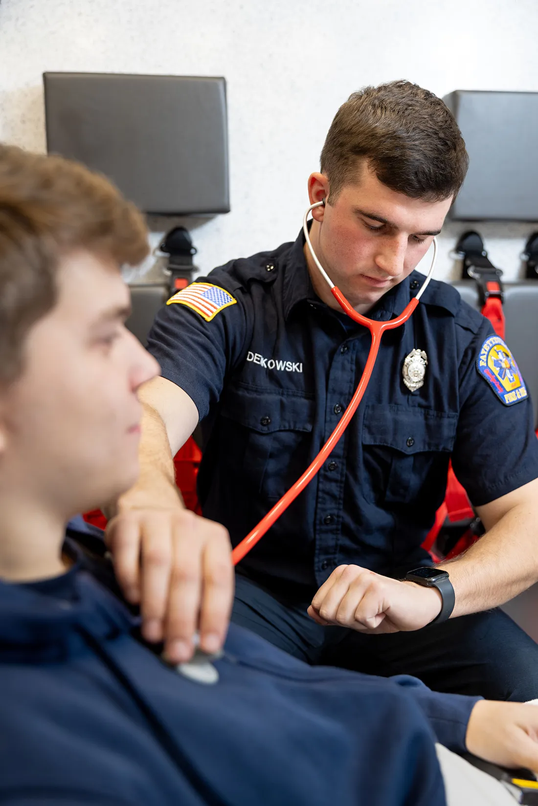 Ryan Derkowski taking someone's heart rate.