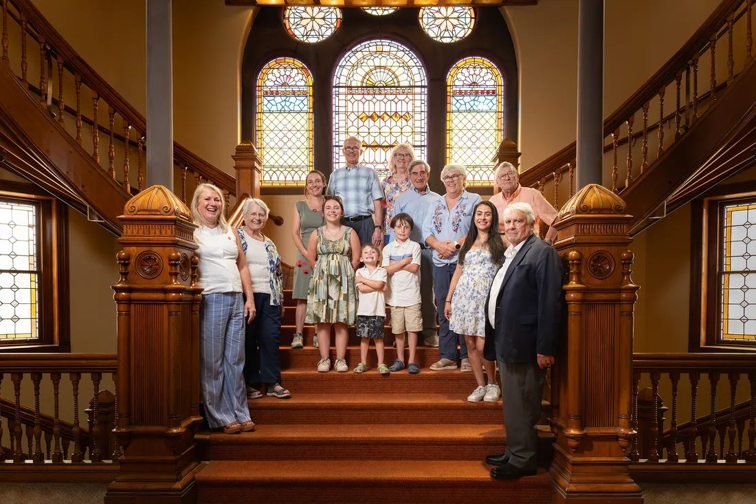 People standing on stairs in Hendricks Chapel to pose for a picture.