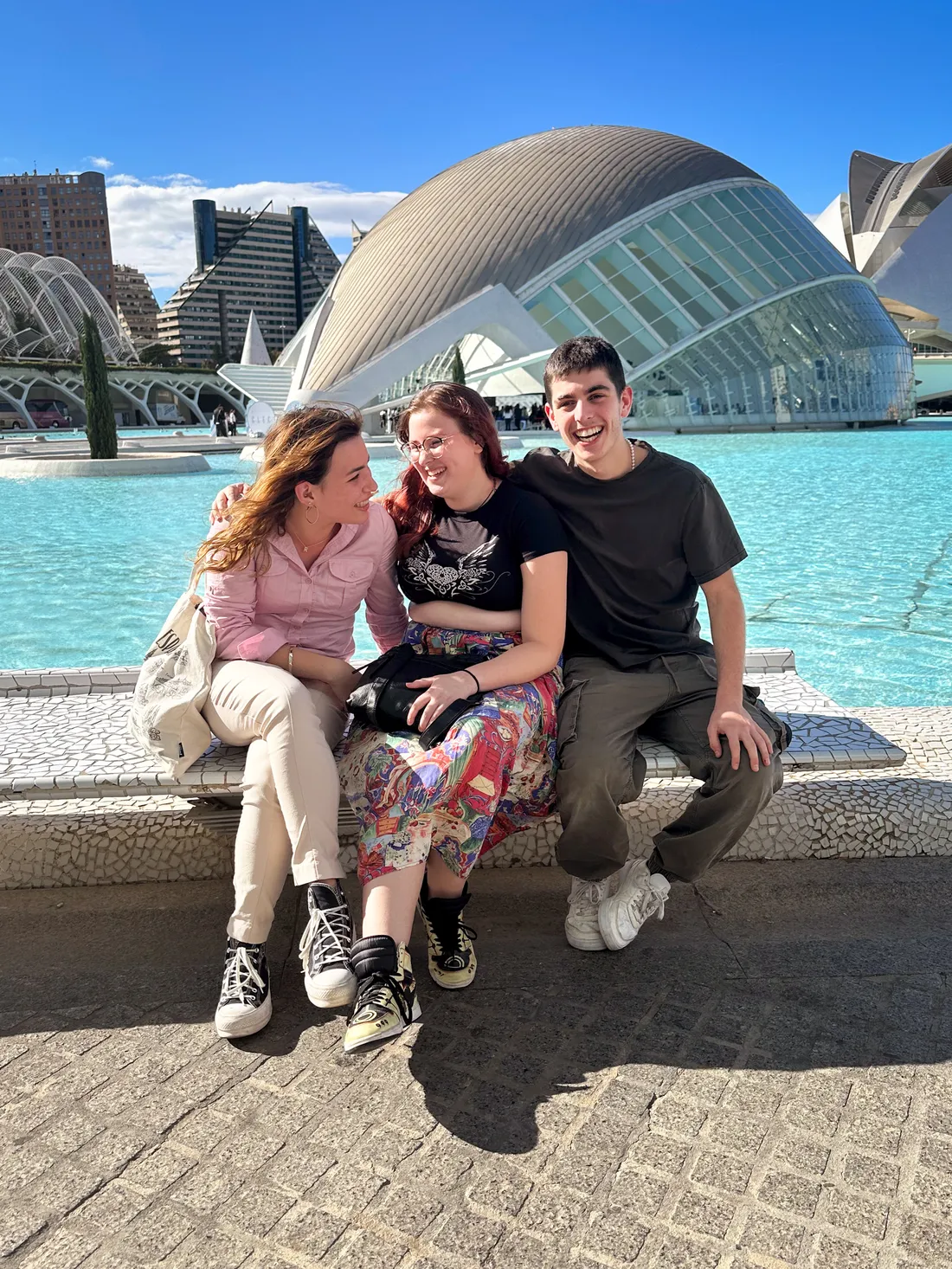 Kayl Pierce In on an excursion to Valencia, Spain sitting and laughing with friends.