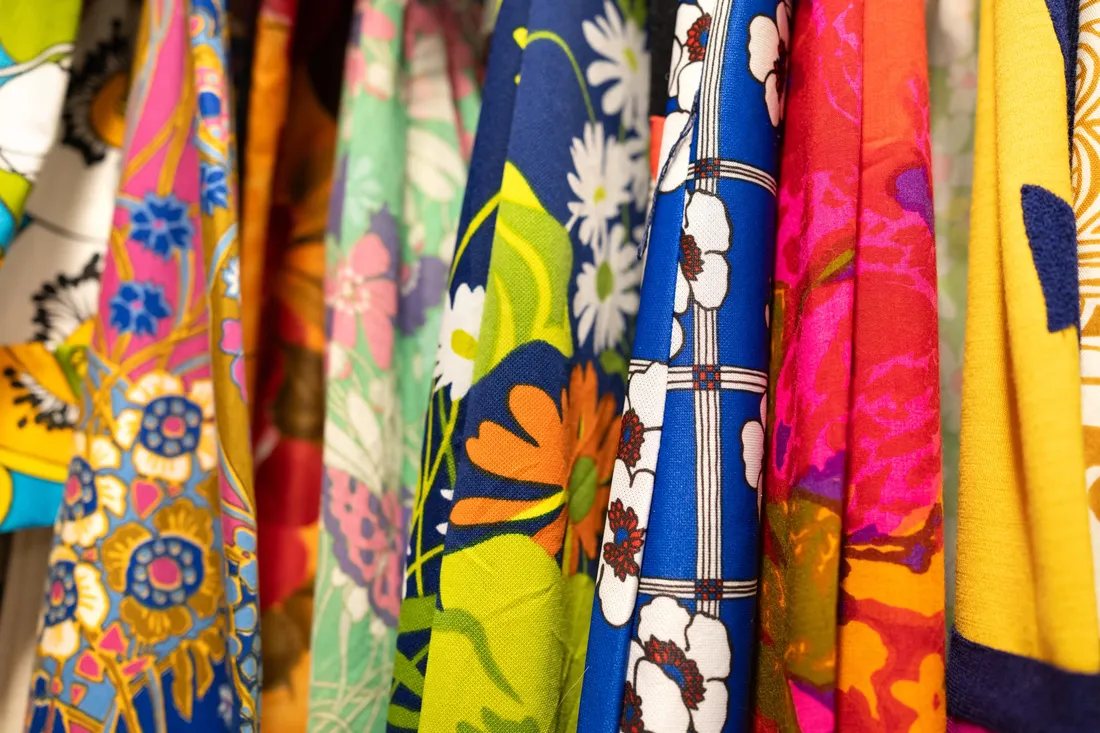 Close up of floral, colorful fabrics.