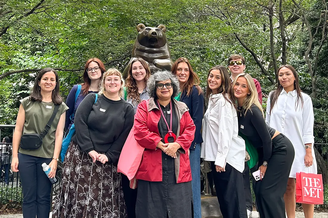 Students and faculty smiling at camera