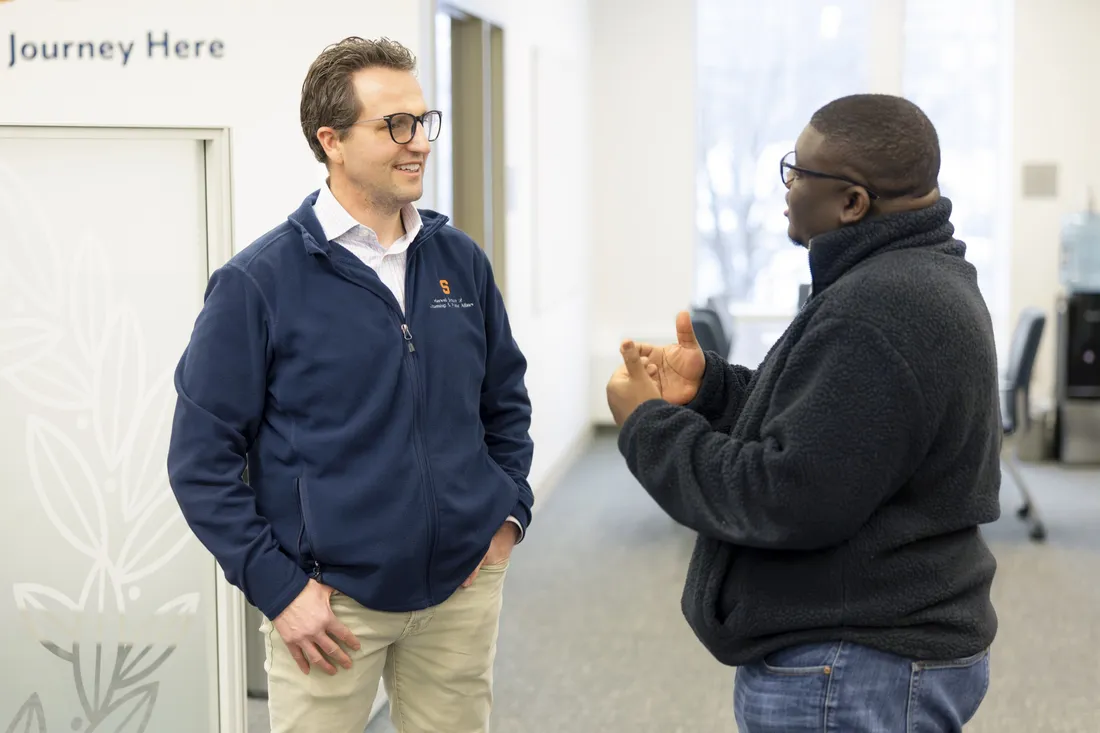 Peter Forsgren '97 speaking with a student at an entrepreneurship event.