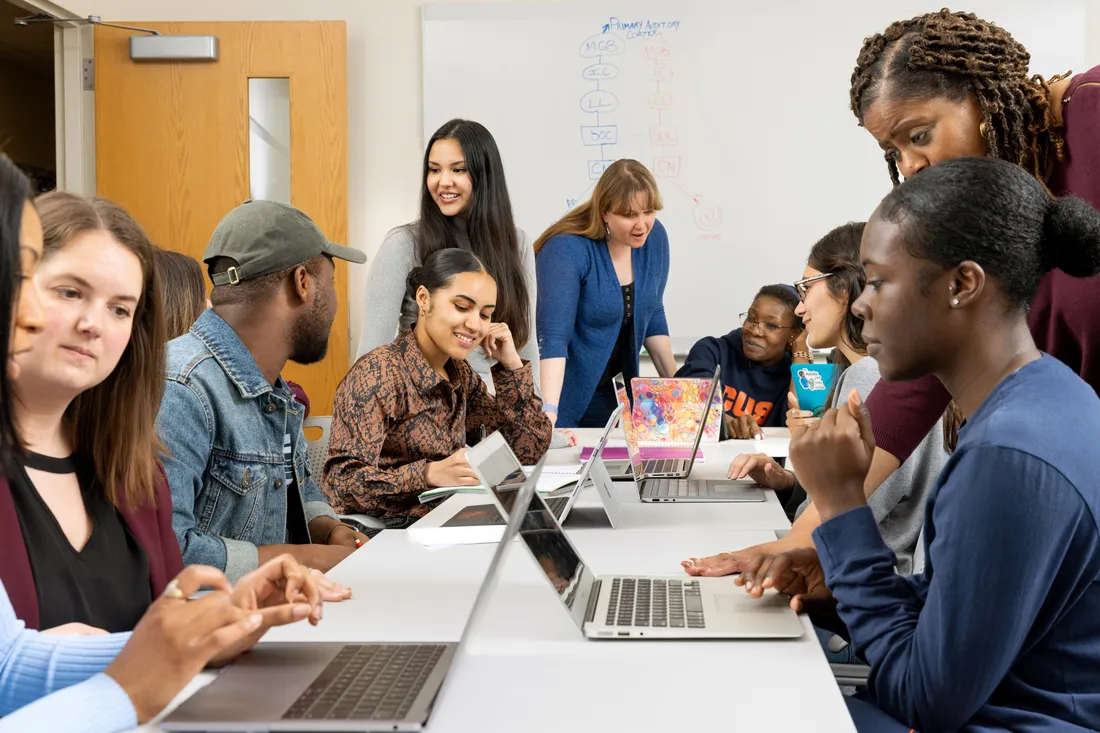 Student support group, ALIGN, having a conversation together in a classroom.