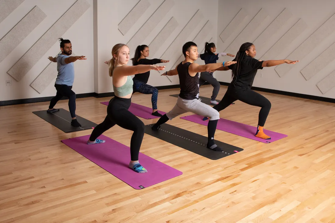 Student rock climbing at the The Barnes Center.