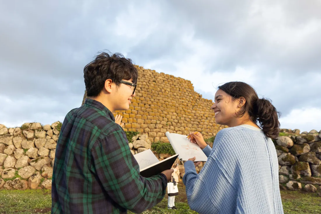 Students sketching in Sardinia while studying abroad.