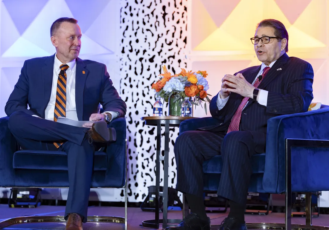Alumnus Dan D'Aniello sitting with Chancellor Mike Haynie.