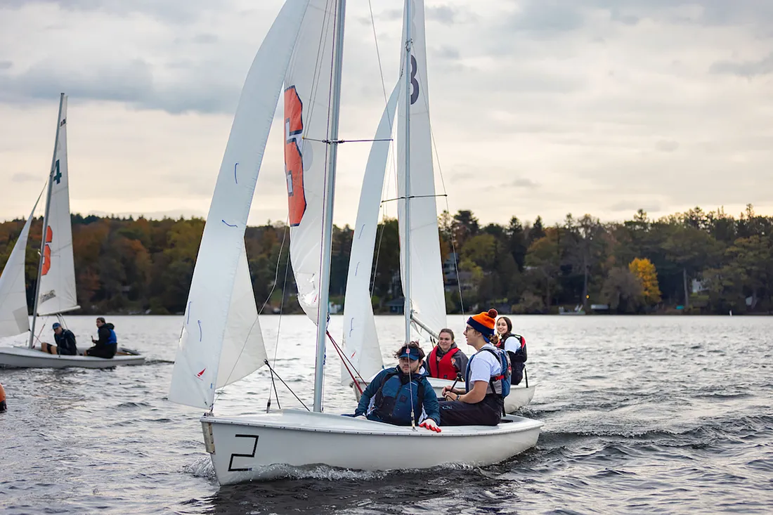 People in a sailboat.