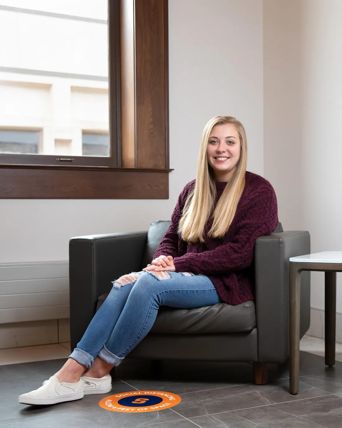 Transfer student Alisamarie Yiatras sitting and smiling.