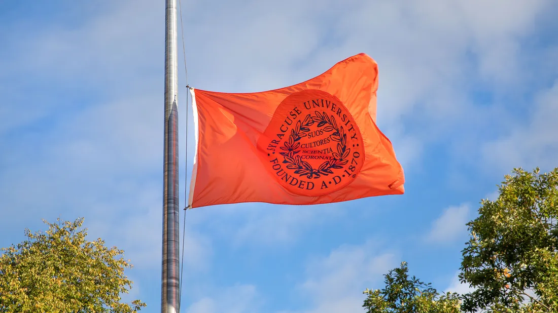 Syracuse University flag in the wind.