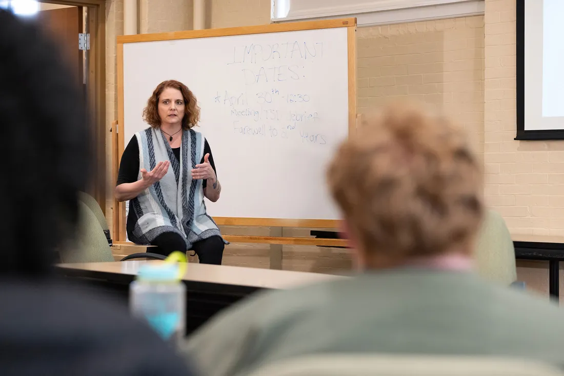 Marriage and family therapy professor Deb Coolhart G’01, G’06 in a discussion during the team’s monthly meeting in April.