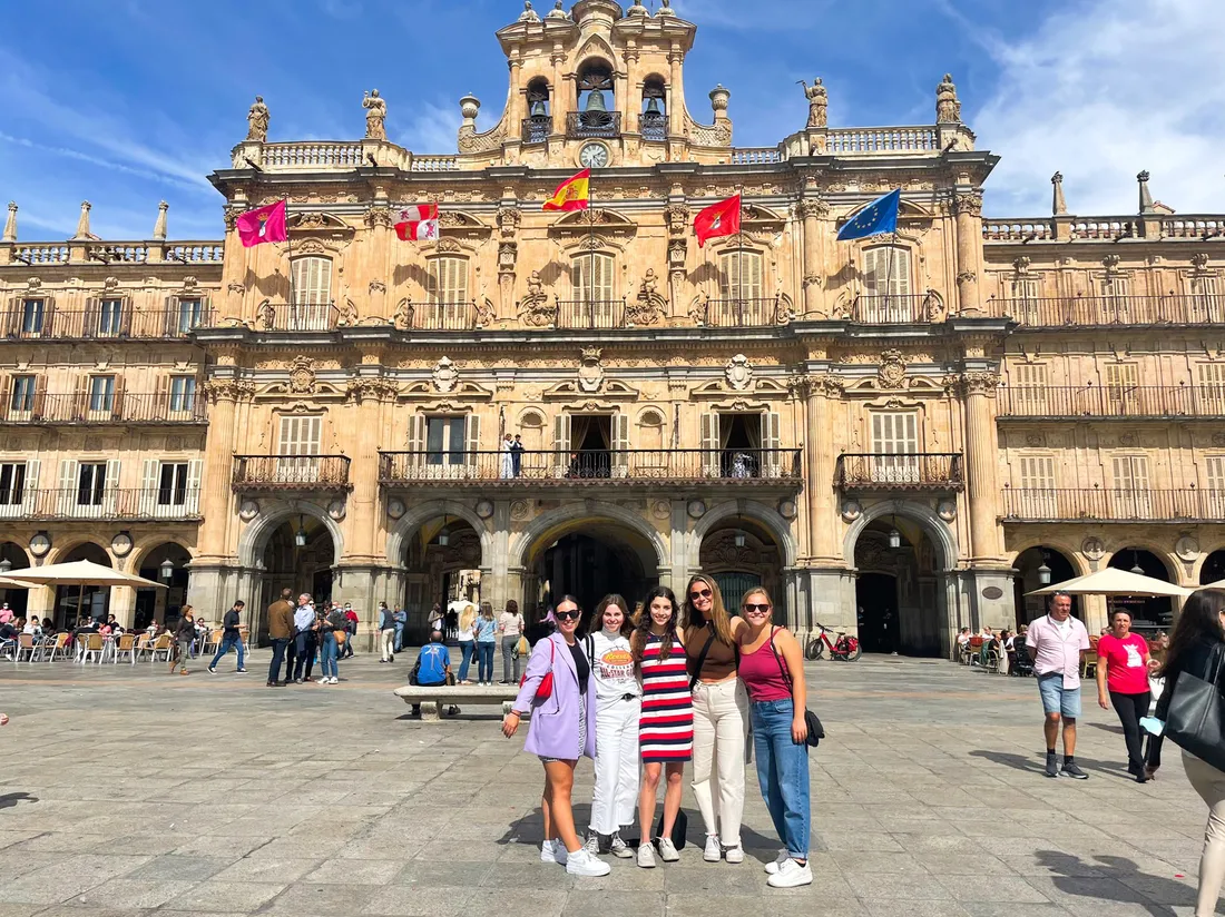 Students standing outside the Salamanca Plaza Mayor in Madrid, Spain.