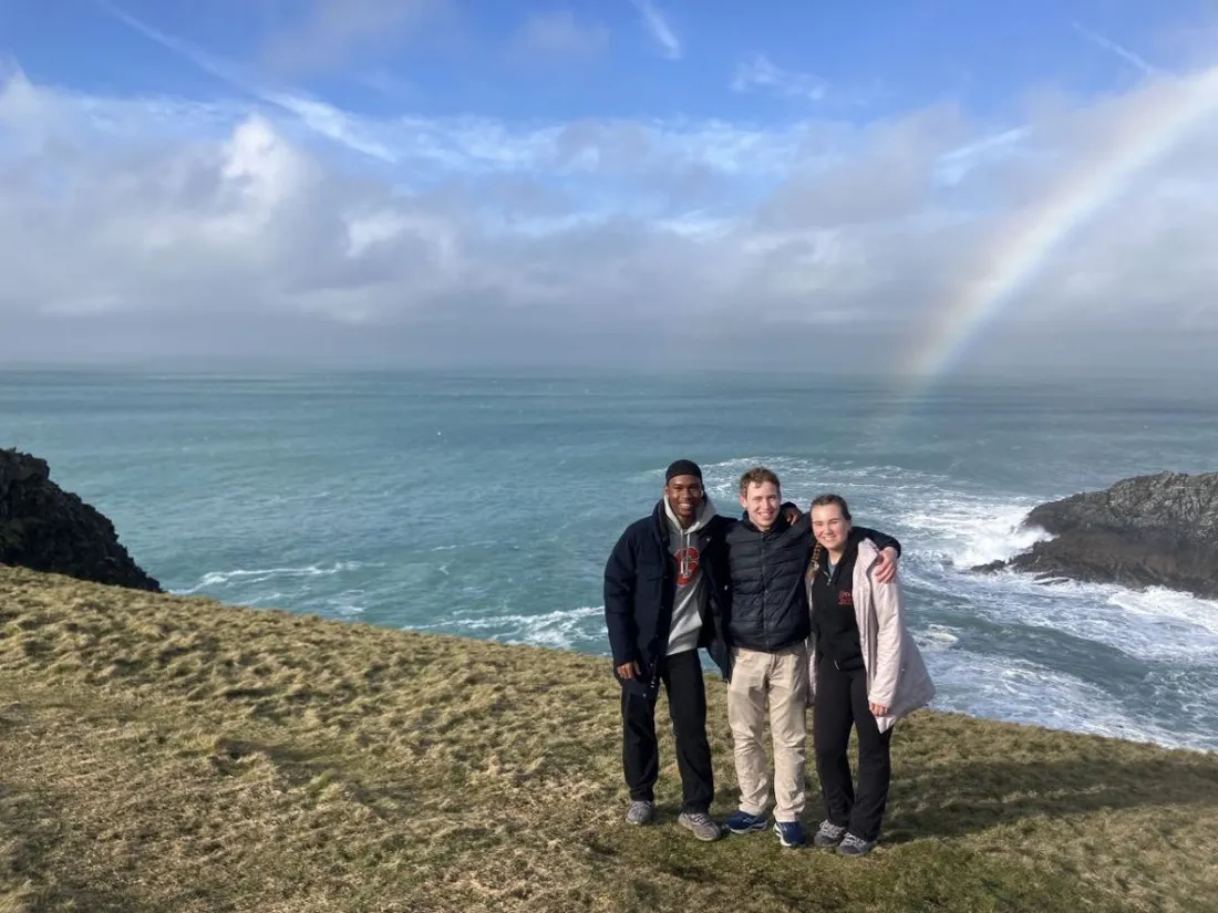 Three Lender Global Fellows standing together at Poly Joke Costal Path in February 2025.