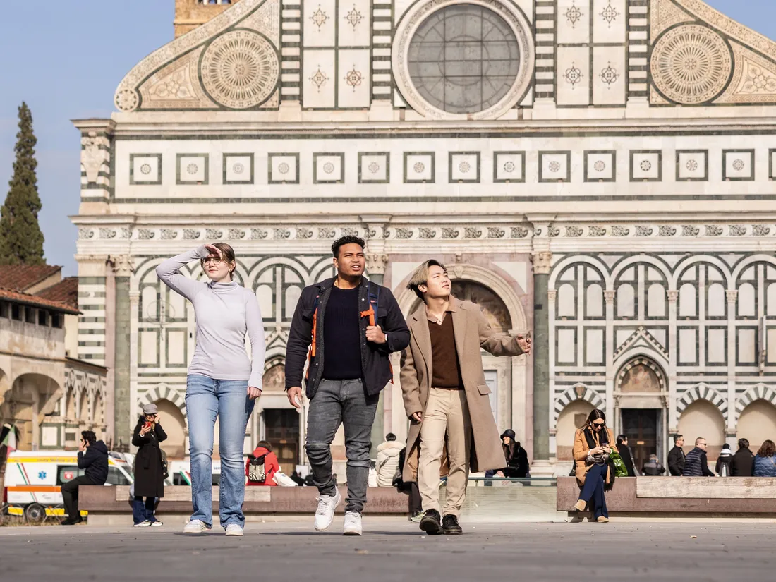 Students walking on a street in Florance.