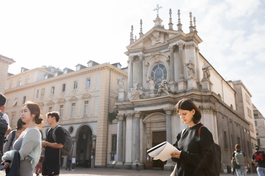Student holding a book in Florence, Italy.