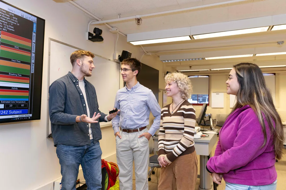 School of Education students standing and talking together.