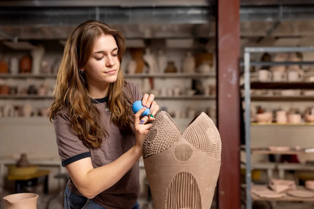 Student working on a ceramics project.