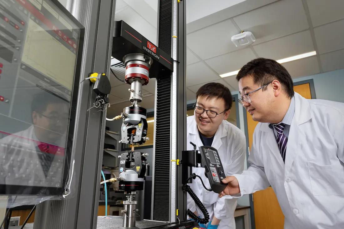 Students using laboratory equipment.