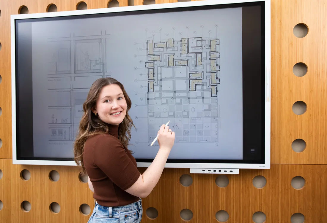 Person drawing on a board.